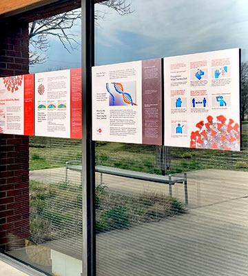 Exhibit mounted on windows outside Kauffman Museum front entrance