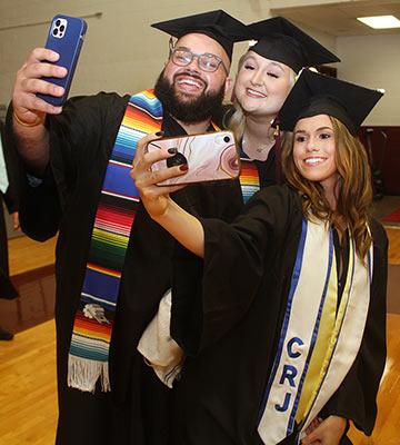 Graduates taking selfies