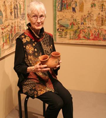 Reinhild Janzen with birth ritual clay pots from Uganda