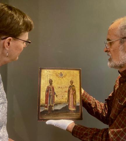 Andi Schmidt Andres and Dave Kreider look at an icon of Saints Boris and Gleb.