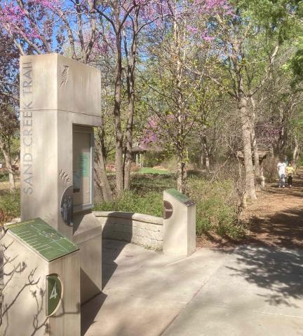A springtime view of the Memorial Grove trailhead of Sand Creek Trail