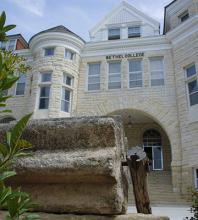 Ad Building with threshing stone, by Glen Ediger