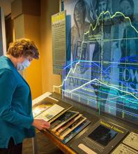 A viewer examines the "Vapes" exhibit at NMC Health.