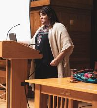 Karen Gonzalez speaking in the chapel