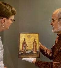 Andi Schmidt Andres and Dave Kreider look at an icon of Saints Boris and Gleb.